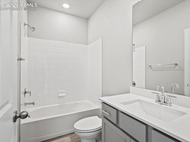 10434 Devoncove Dr, Peyton, CO 80831 - bathroom featuring toilet, shower / washtub combination, wood finished floors, and vanity