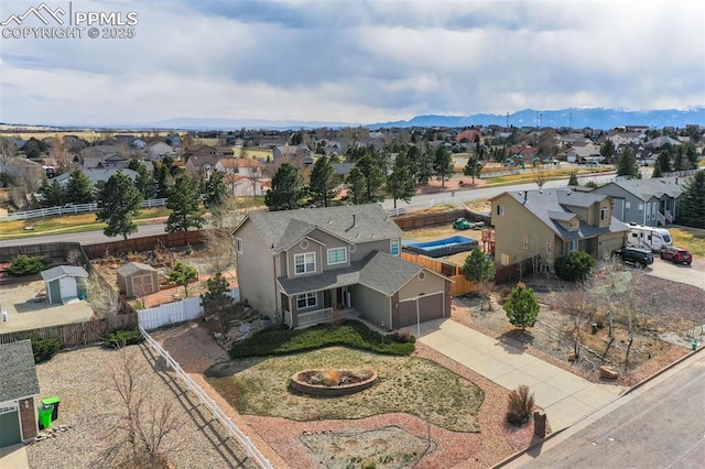 birds eye view of property with a mountain view