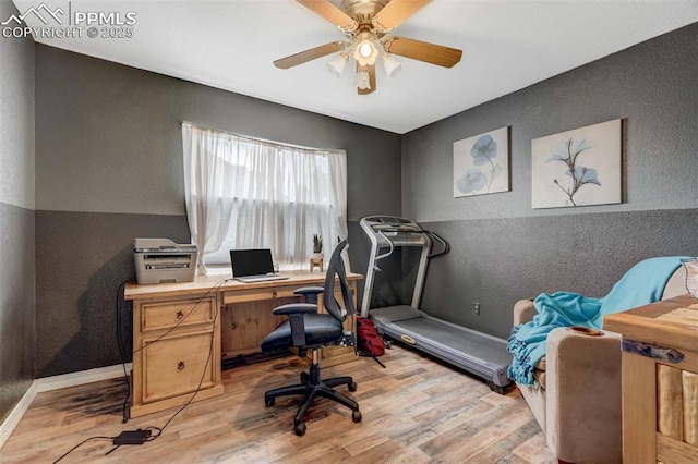 office space featuring ceiling fan and light hardwood / wood-style floors