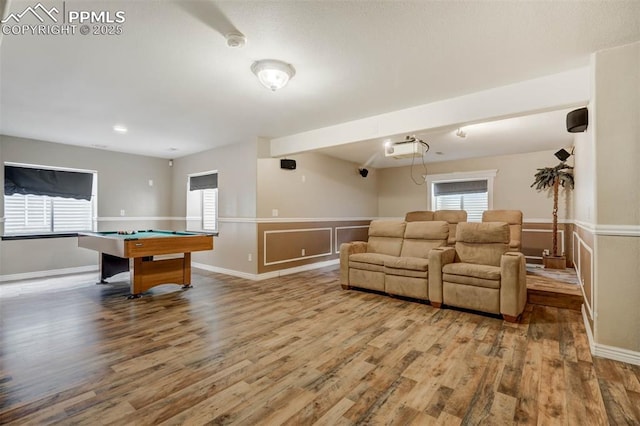 interior space featuring pool table, plenty of natural light, and hardwood / wood-style flooring