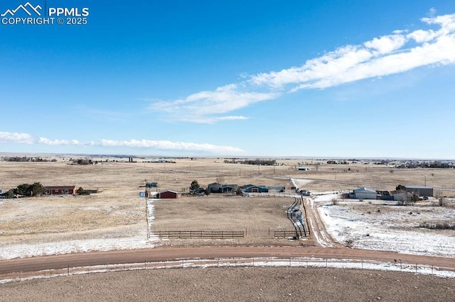 birds eye view of property with a rural view