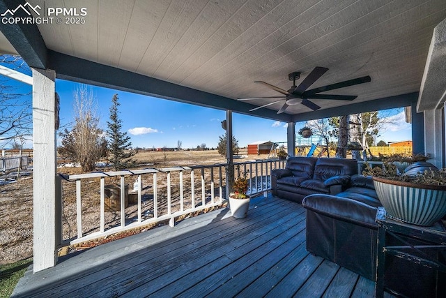 deck featuring ceiling fan and an outdoor living space