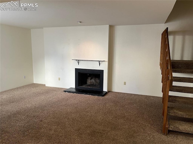 unfurnished living room with carpet flooring