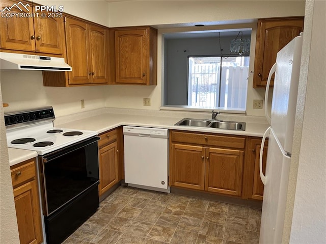 kitchen featuring sink and white appliances