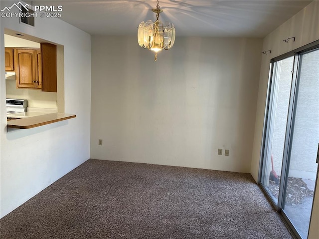 unfurnished dining area featuring a notable chandelier and carpet floors