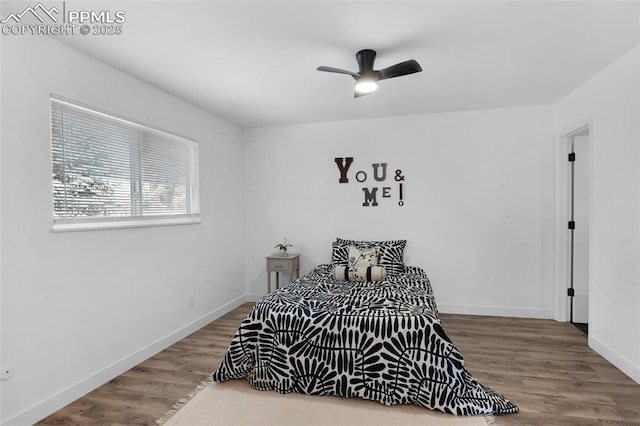 bedroom featuring hardwood / wood-style floors and ceiling fan