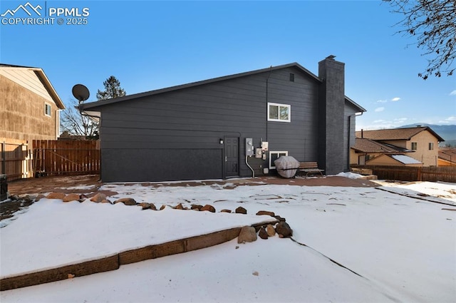 view of snow covered house