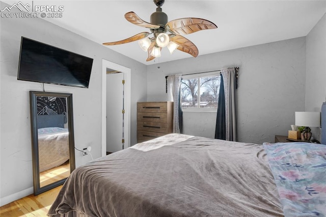 bedroom with ceiling fan and light wood-type flooring