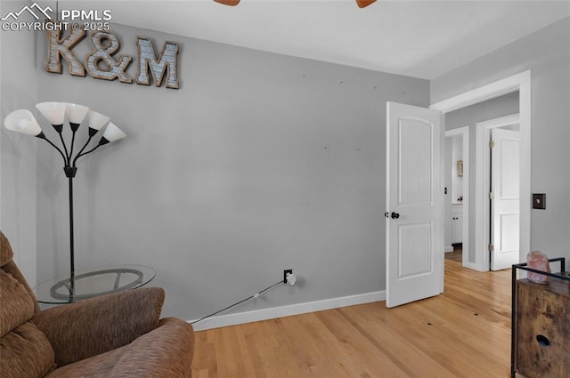 living area with hardwood / wood-style flooring