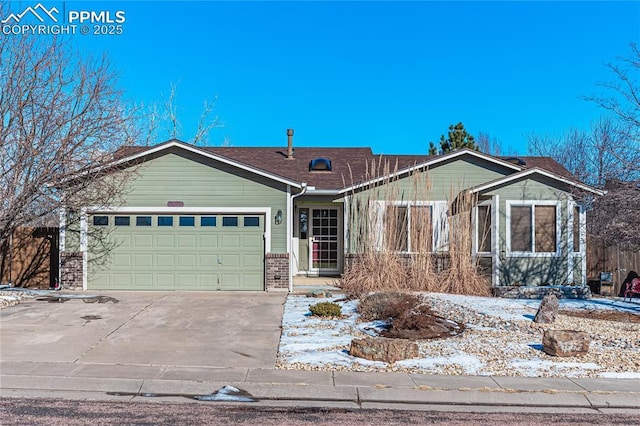 single story home featuring a garage