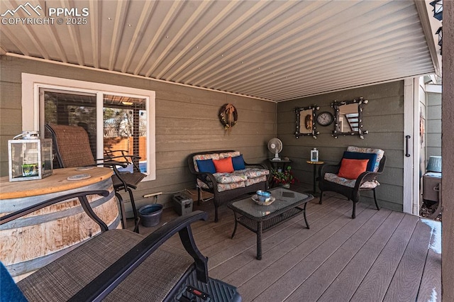 wooden deck featuring outdoor lounge area