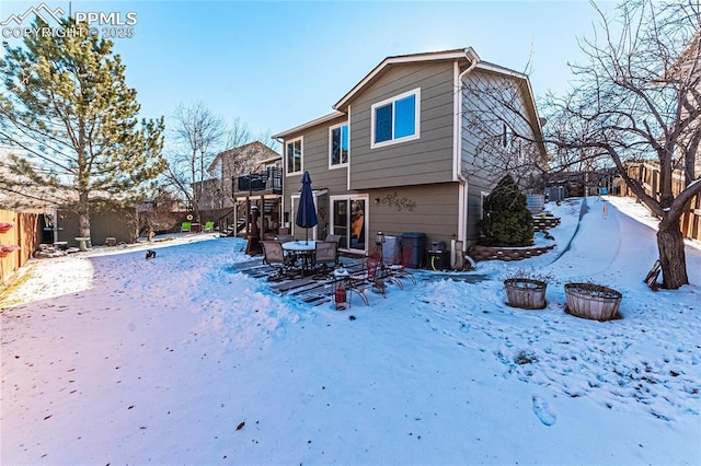 view of snow covered house