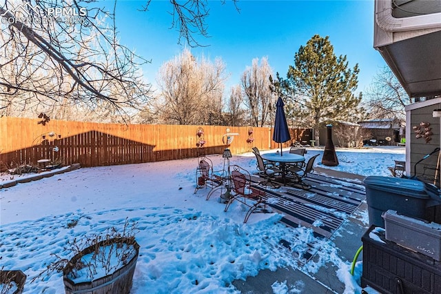 view of yard layered in snow