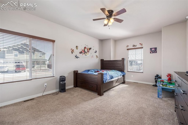 carpeted bedroom with ceiling fan