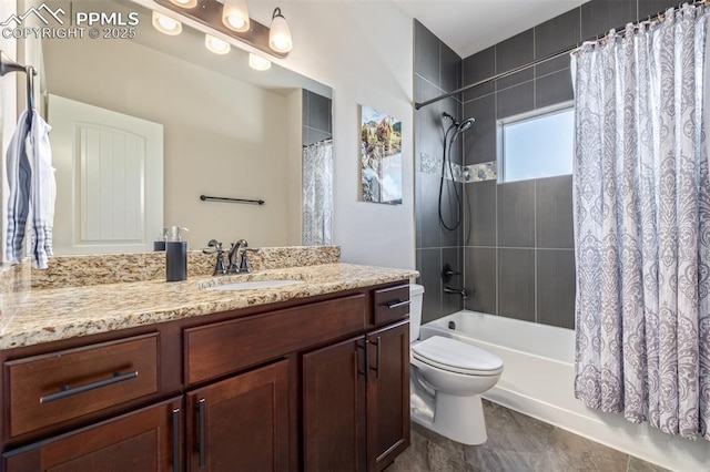 full bathroom featuring vanity, shower / bath combo with shower curtain, and toilet