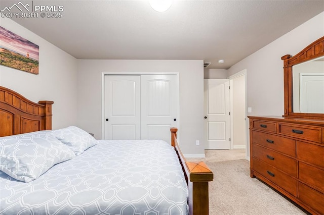 carpeted bedroom with a closet