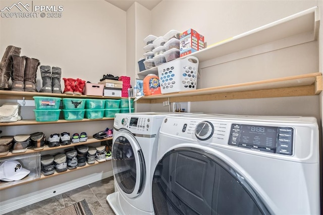 laundry room with washing machine and clothes dryer