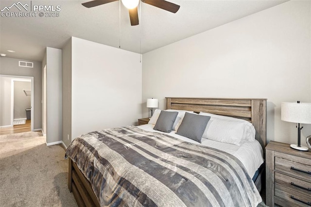 bedroom with light colored carpet and ceiling fan