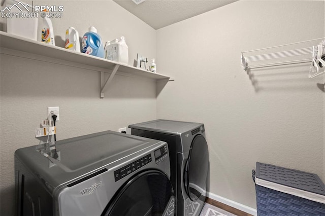 clothes washing area featuring dark wood-type flooring and separate washer and dryer