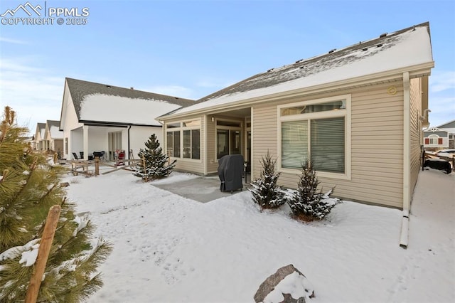 view of snow covered property