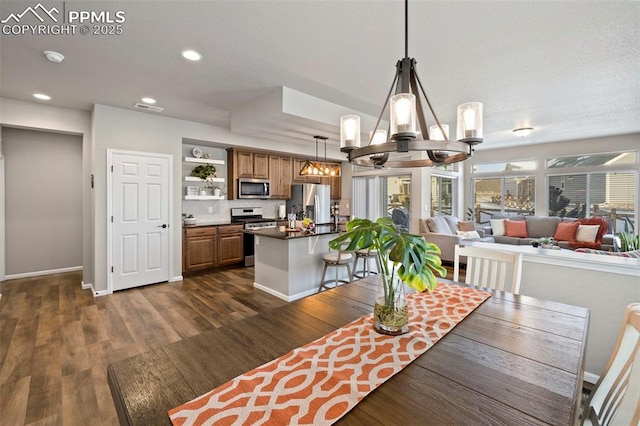 dining room featuring an inviting chandelier and dark hardwood / wood-style floors