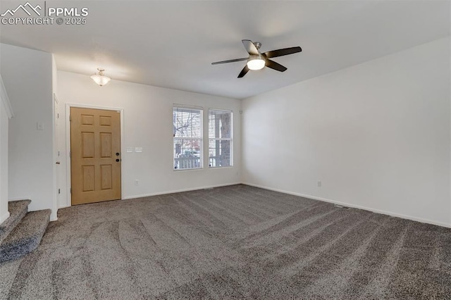 spare room featuring carpet floors and ceiling fan