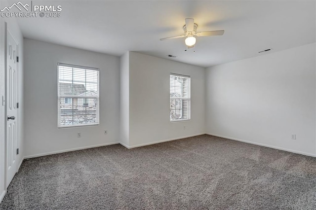 carpeted spare room with ceiling fan and a wealth of natural light