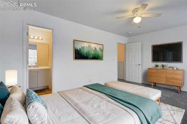 bedroom with ceiling fan, light colored carpet, and connected bathroom