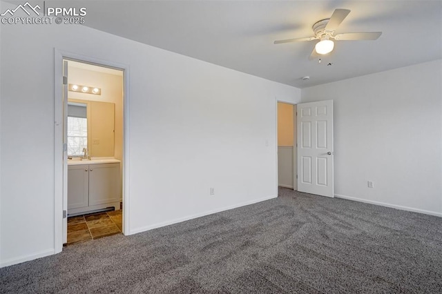 unfurnished bedroom with ensuite bath, ceiling fan, carpet flooring, and sink