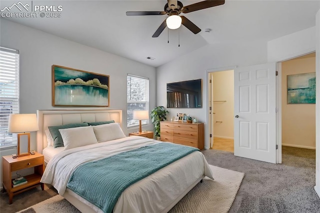 carpeted bedroom featuring lofted ceiling and ceiling fan