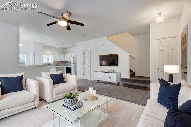 living room featuring ceiling fan and track lighting