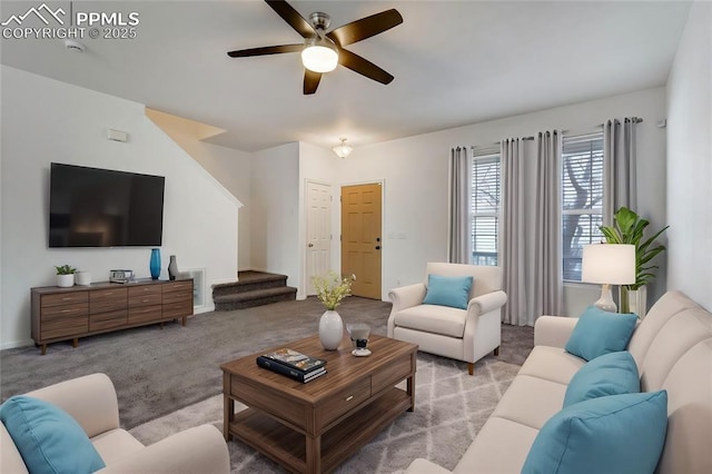 carpeted living room with ceiling fan