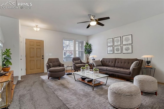 carpeted living room featuring ceiling fan