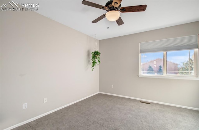 spare room with ceiling fan and carpet flooring