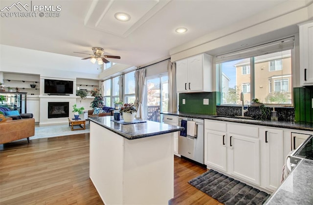 kitchen featuring sink, white cabinets, and a wealth of natural light