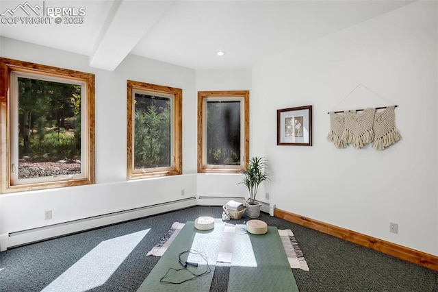 exercise area with carpet floors and baseboard heating