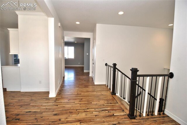 corridor featuring dark wood-type flooring