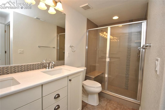 bathroom with toilet, an enclosed shower, vanity, and decorative backsplash