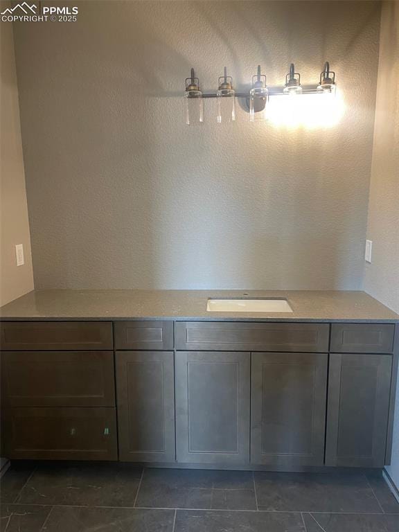 bathroom with tile patterned floors and a sink