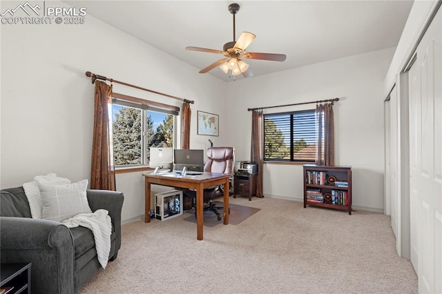 office area with light carpet, a healthy amount of sunlight, and ceiling fan