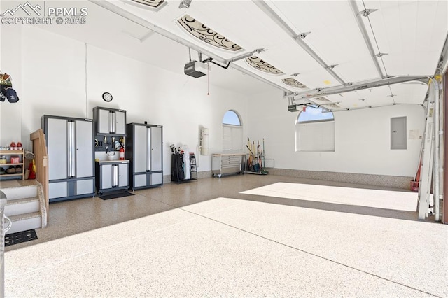 garage featuring a garage door opener and electric panel