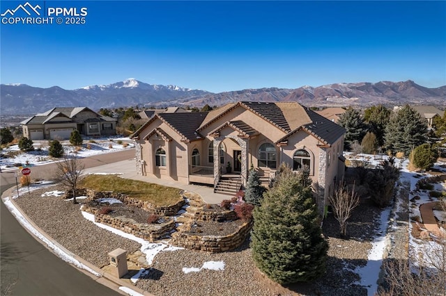 view of front of home featuring a mountain view