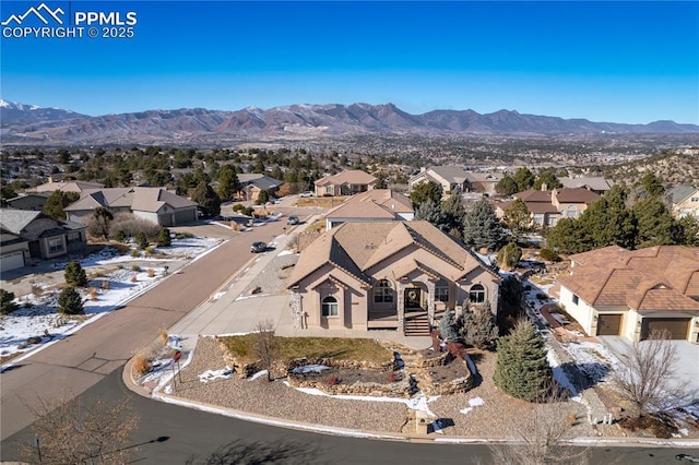 birds eye view of property with a mountain view