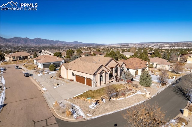 birds eye view of property featuring a mountain view