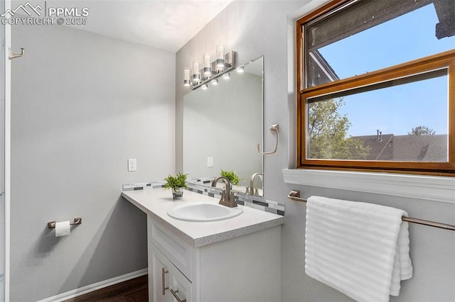 bathroom featuring vanity and hardwood / wood-style flooring