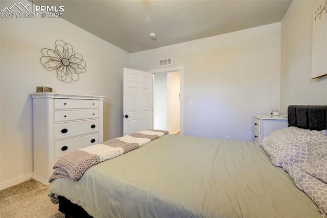 bedroom featuring light colored carpet