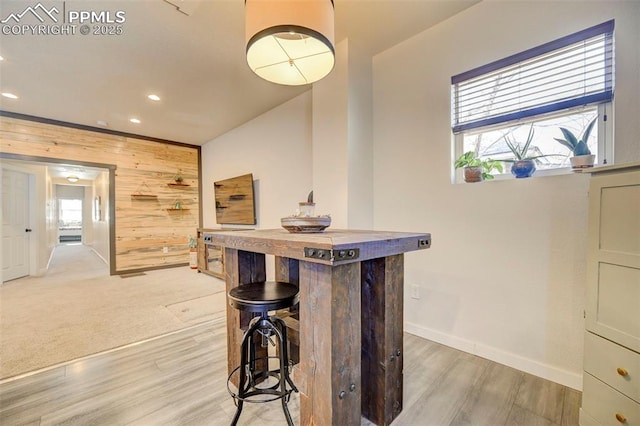 room details with wood-type flooring and wooden walls