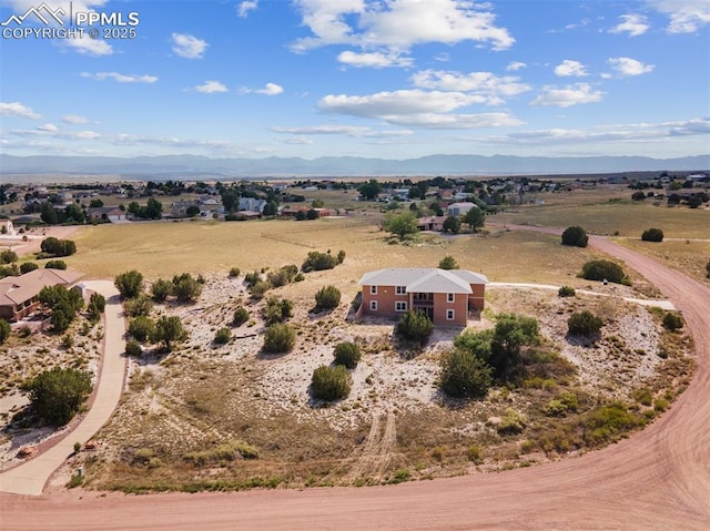 drone / aerial view with a rural view and a mountain view