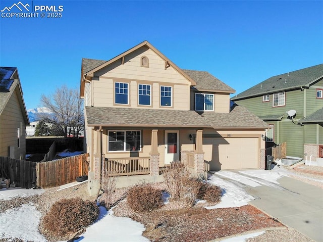 view of front of property with a porch and a garage