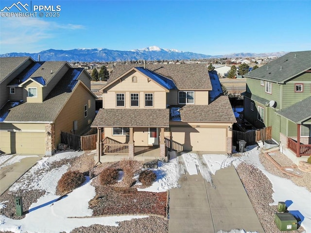 view of front property featuring a porch and a mountain view